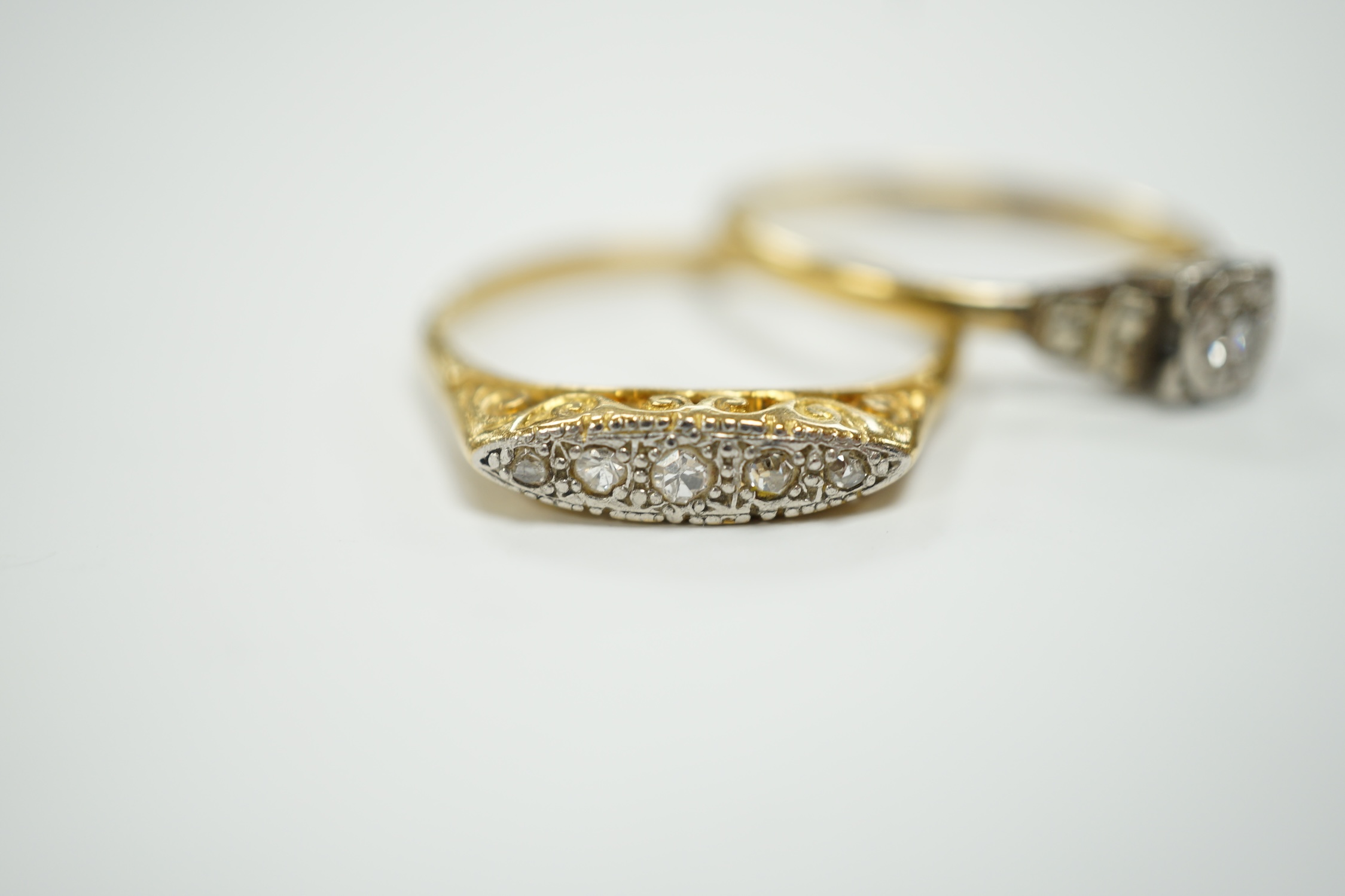 Two early to mid 20th century 18ct, plat and diamond set rings, including graduated five stone, gross weight 7.8 grams.